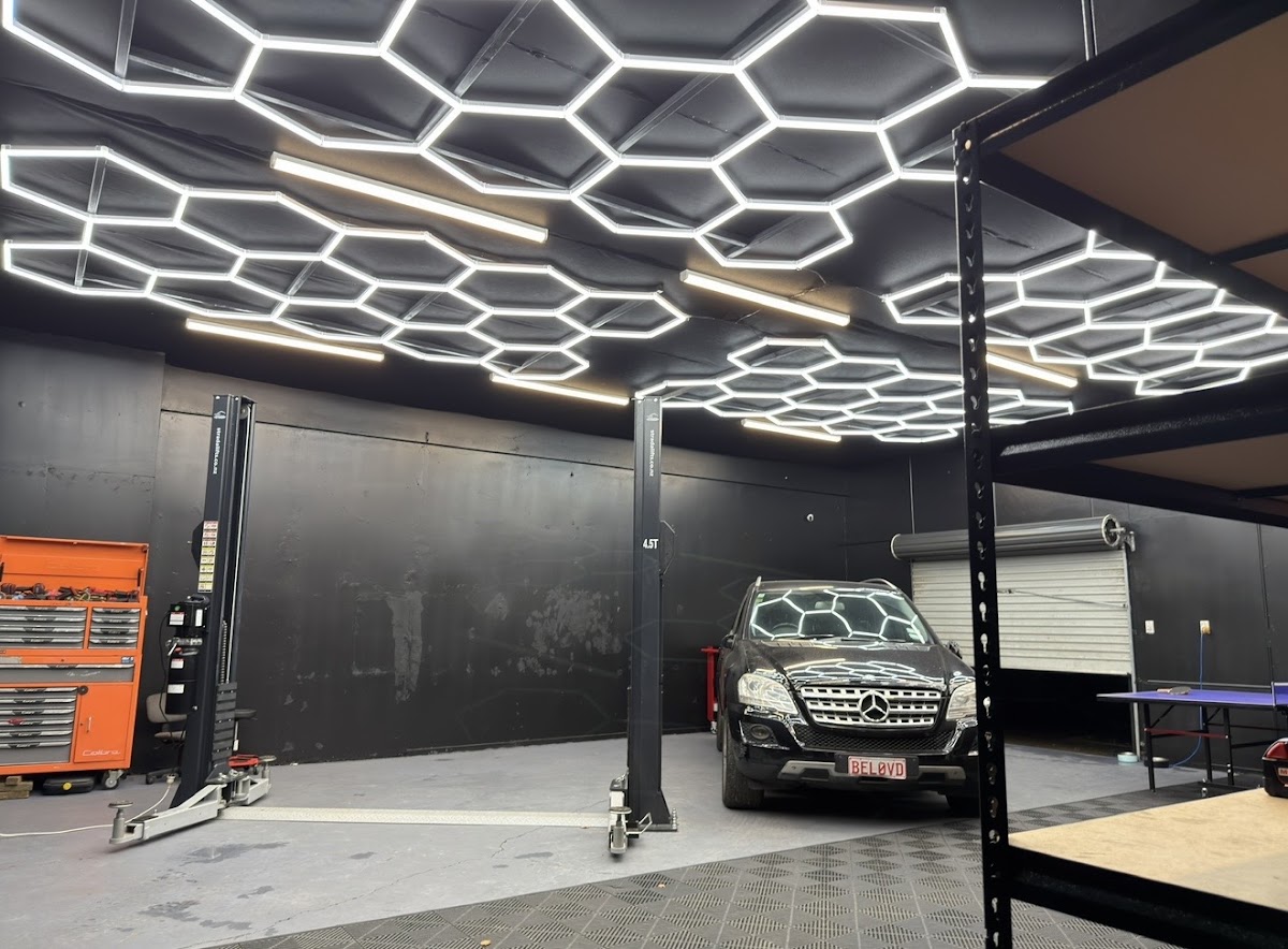Inside the Kinkz Motors workshop with hexagon LED lighting