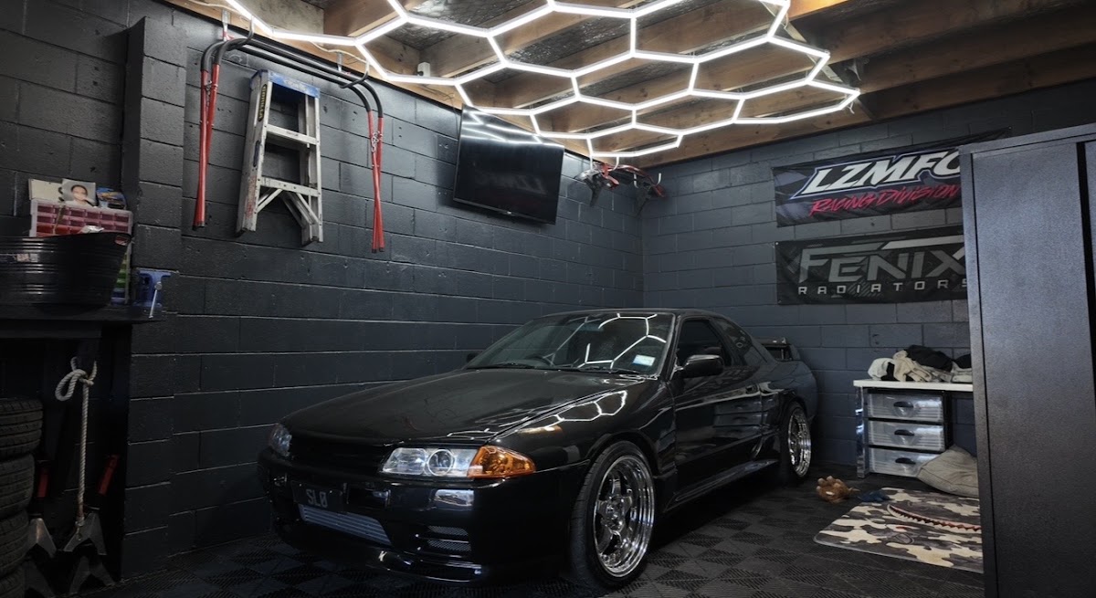 R32 Nissan Skyline in the hex lit garage