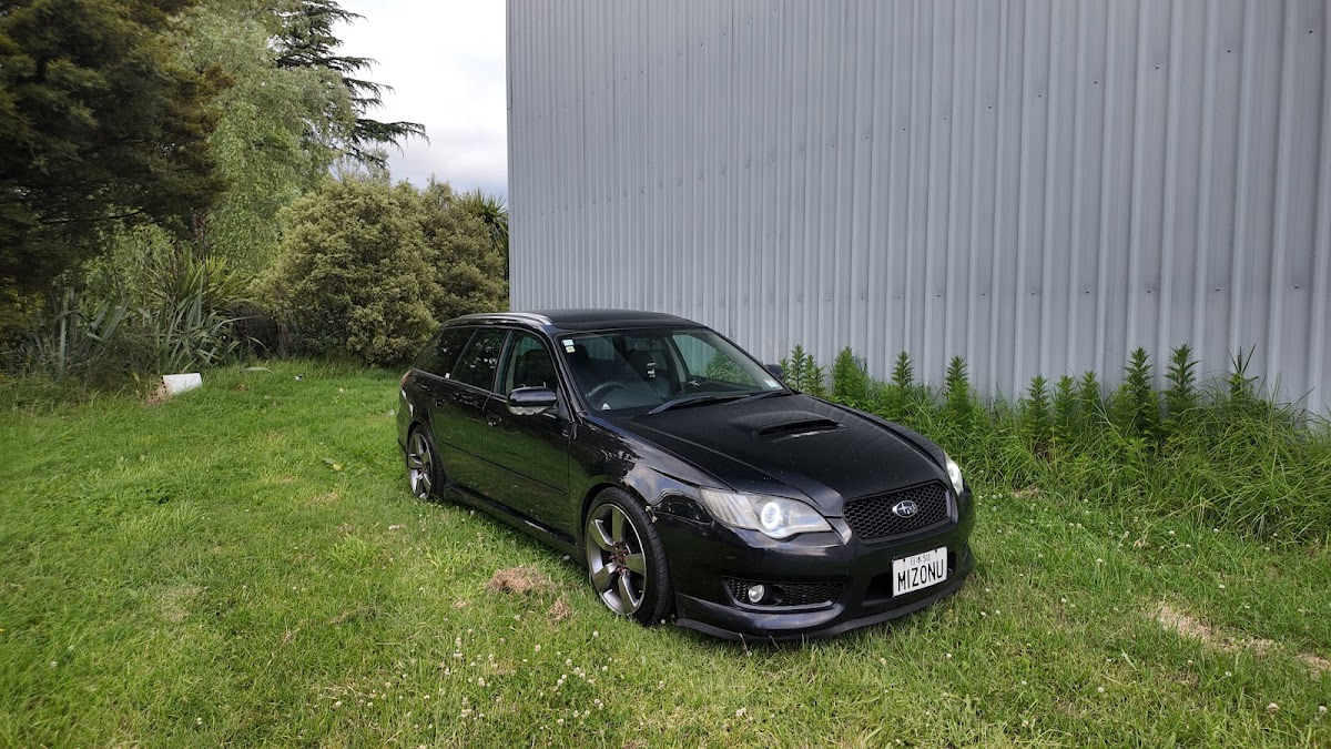 Black Subaru Legacy wagon