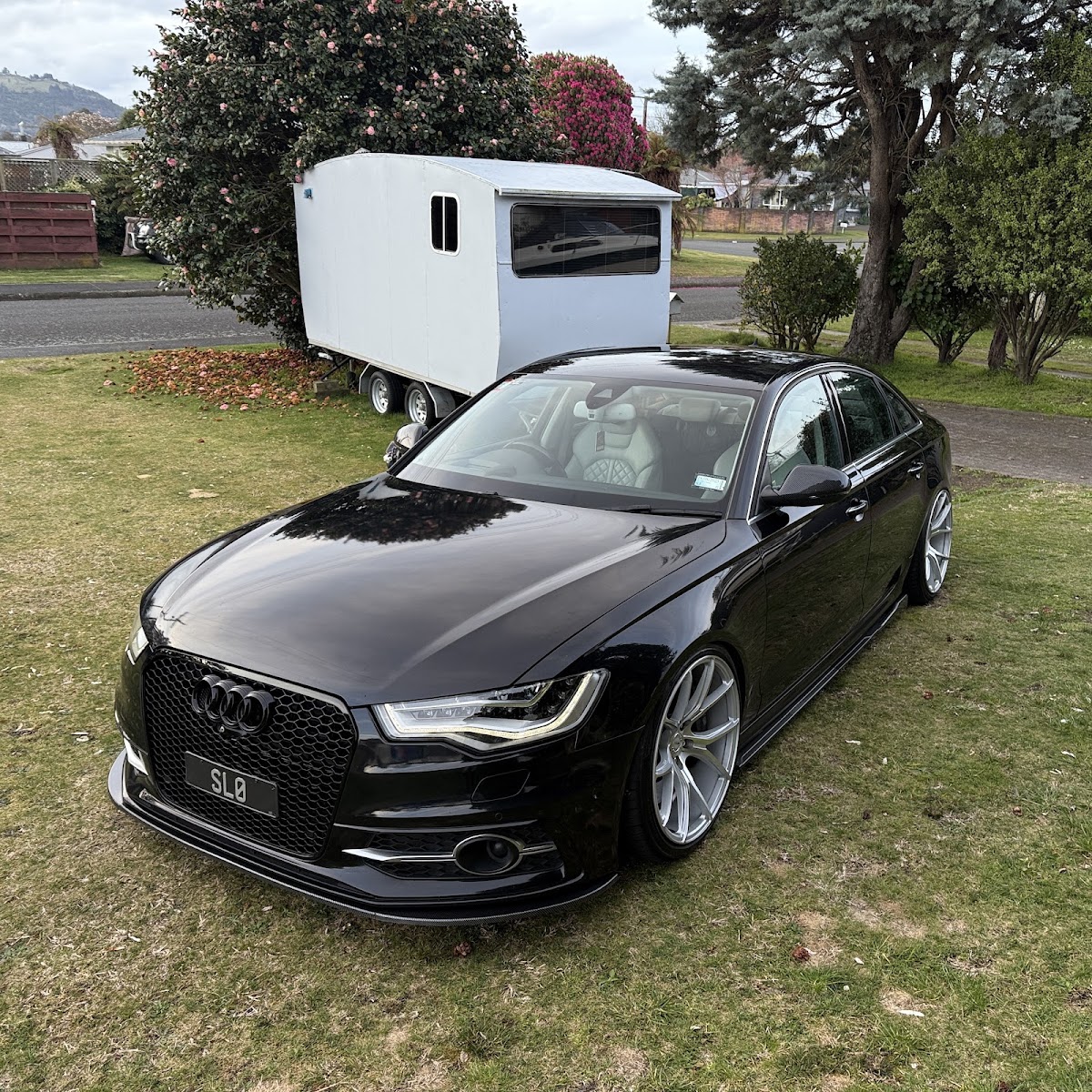 Lowered black Audi A6 on aftermarket wheels